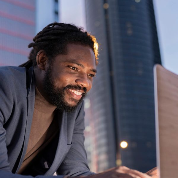 man-in-city-with-laptop-business-at-night-2023-11-27-04-54-11-utc-qydnt4ku78122vyepzvg4u5vezvvmh3tpos71oij5c